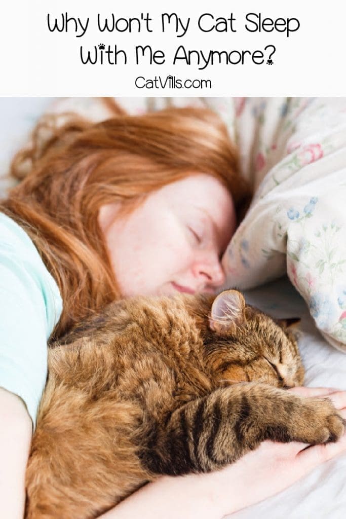 Brown cat sleeping next to red-haired woman with text "Why Won't My Cat Sleep
 With Me Anymore"