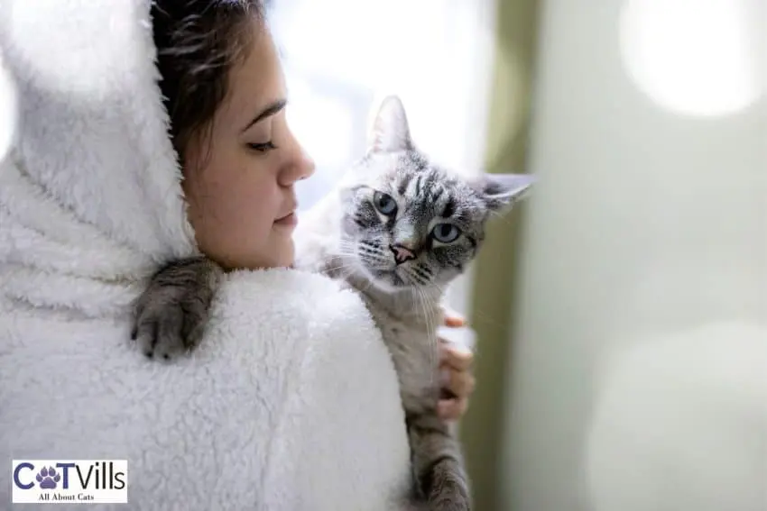 sick lady hugging a cat